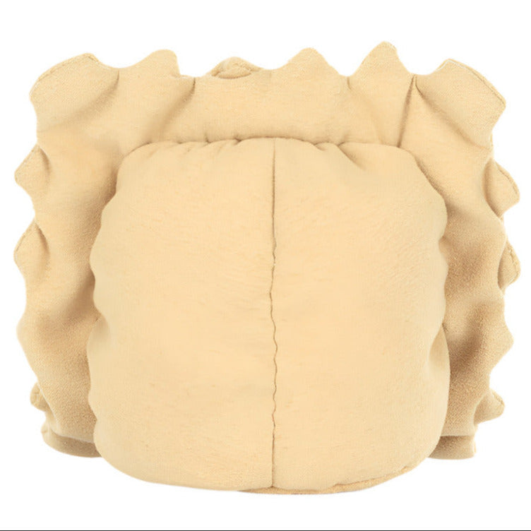 The Jellycat Amuseables Ravioli is a beige, ruffled soft toy resembling a vintage hair bonnet or cap with gathered fabric edges, adding whimsy to any kitchen shelf.