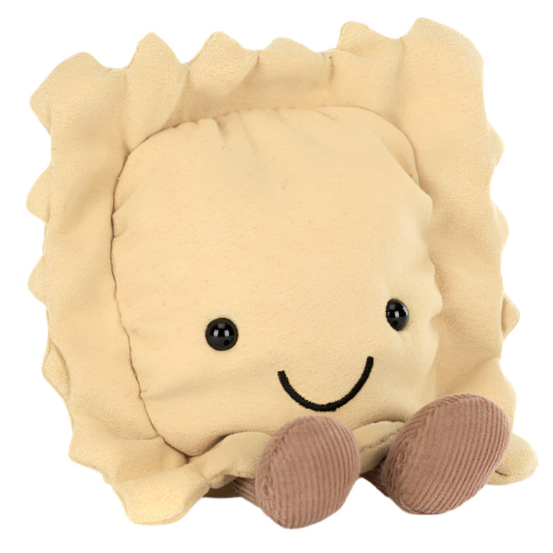 The Jellycat Amuseables Ravioli is a charming plush toy shaped like beige pasta, featuring a smiling face, stitched eyes, and brown textured feet. It's the perfect addition to any kitchen shelf with its delightful presence.