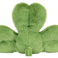 A plush green pillow shaped like a four-leaf clover, photographed from the back on a white background. The Jellycat Amuseables Siofra Shamrock adds charm and whimsy to any space.