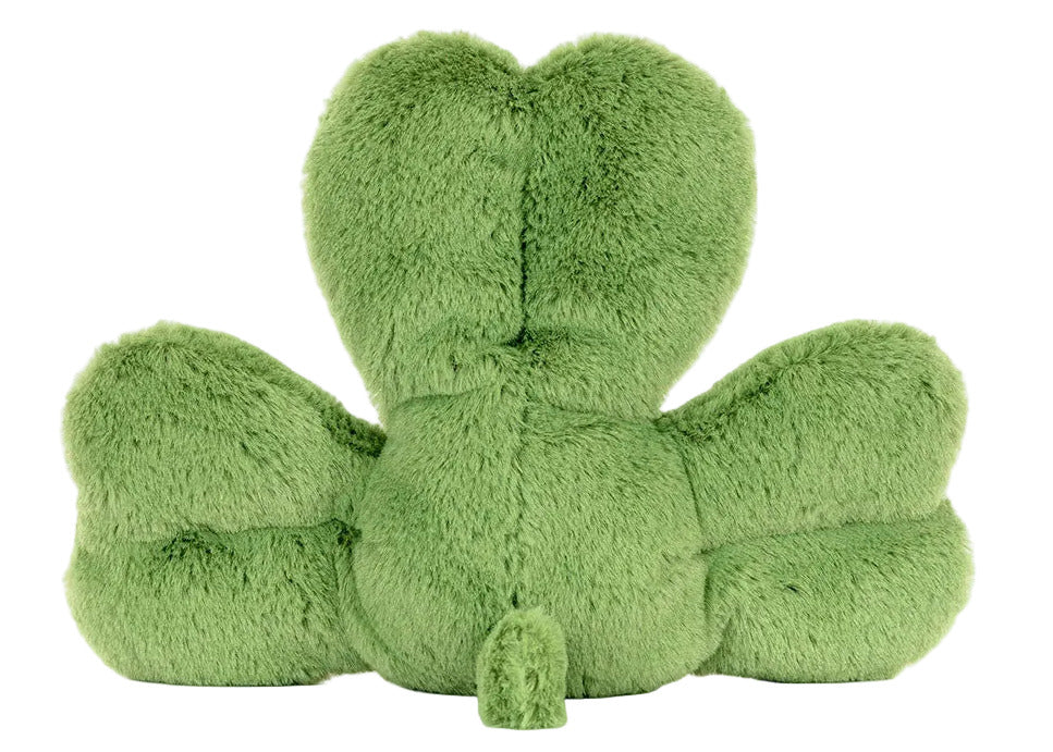 A plush green pillow shaped like a four-leaf clover, photographed from the back on a white background. The Jellycat Amuseables Siofra Shamrock adds charm and whimsy to any space.