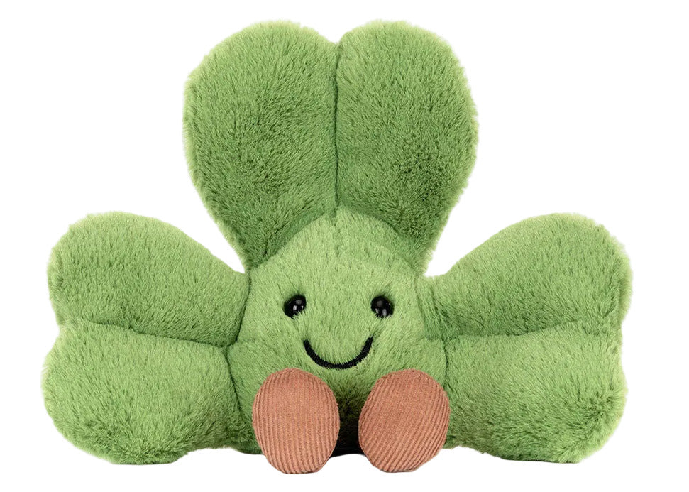 Amuseables Siofra Shamrock by Jellycat is a plush green four-leaf clover toy with a smiling face and two brown feet, perfect for adding luck and charm to any collection.