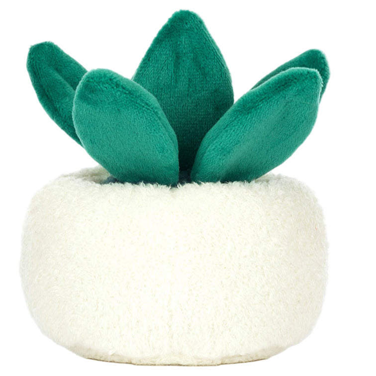 The Jellycat Amuseables Skull Planter is a plush toy shaped like a green succulent with thick leaves, set in a round, white, fuzzy skull planter for a playful touch.