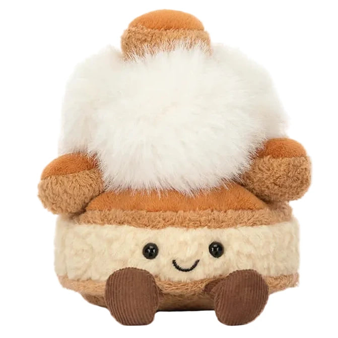 Soft plush toy shaped like a St. Honoré cake with a smiling face and charming details—part of the adorable Jellycat Amuseables Mirielle St. Honoré Cake collection.