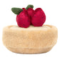 This plush dog toy, from Jellycat, is the Amuseables Fleurette Tarte Aux Fraises, featuring vibrant red strawberries and green leaves on a realistic pâte sucrée crust.