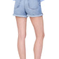 Model shown from the back wearing a light blue long-sleeve shirt, Anine Bing Heath Short in vintage blue wash, and black flat shoes against a white background.