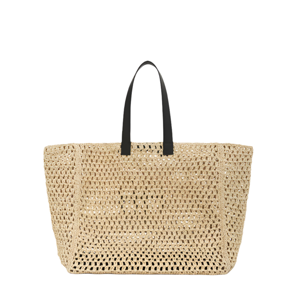 The Large Rio Tote by Anine Bing is a spacious woven seagrass straw bag with black handles and the signature monogram, shown against a plain white background.