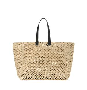 The Large Rio Tote by Anine Bing is a spacious woven seagrass straw bag with black handles and the signature monogram, shown against a plain white background.