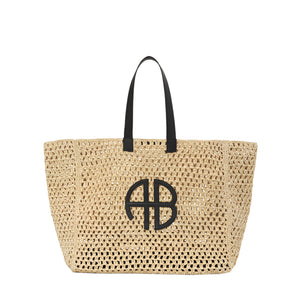 Large Rio Tote by Anine Bing, crafted from woven seagrass, features black handles and a striking black ANINE BING monogram on the front.