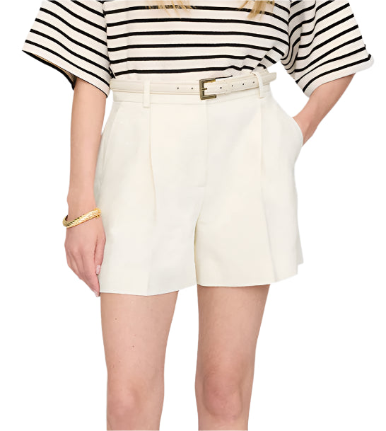 A person wears a black-and-white striped top with Anine Bing's high-waisted Trent Short, crafted from suiting fabric and finished with a matching belt, posing with one hand in the pocket.