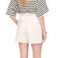 A person in a black and white striped shirt and Anine Bing Trent Short in textured viscose stands with their back to the camera.