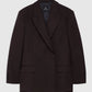 The Aretha Blazer by Anine Bing is a dark brown wool tuxedo blazer with a slim hourglass fit, notched collar, chest pocket, two front flap pockets, and buttoned cuffs, shown against a plain background.