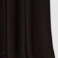 A close-up of the Bar Silk Skirt by Anine Bing, a black high-waisted midi skirt in silk, shown hanging against a light gray background.
