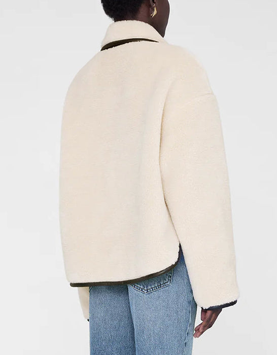A person is shown from the back wearing the cream Camden Jacket by Anine Bing with light blue jeans against a plain white background.