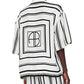 Person wears the Anine Bing Coco Shirt Monogram Stripe, featuring an ivory and black geometric stripe pattern with "AB" lettering on the back, paired with matching striped cupro-blend pants.