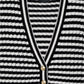 The Gwen Stripe Cardigan by Anine Bing is a chic black and white striped piece made from a luxurious wool-cashmere blend, featuring a V-neck and four elegant gold buttons.