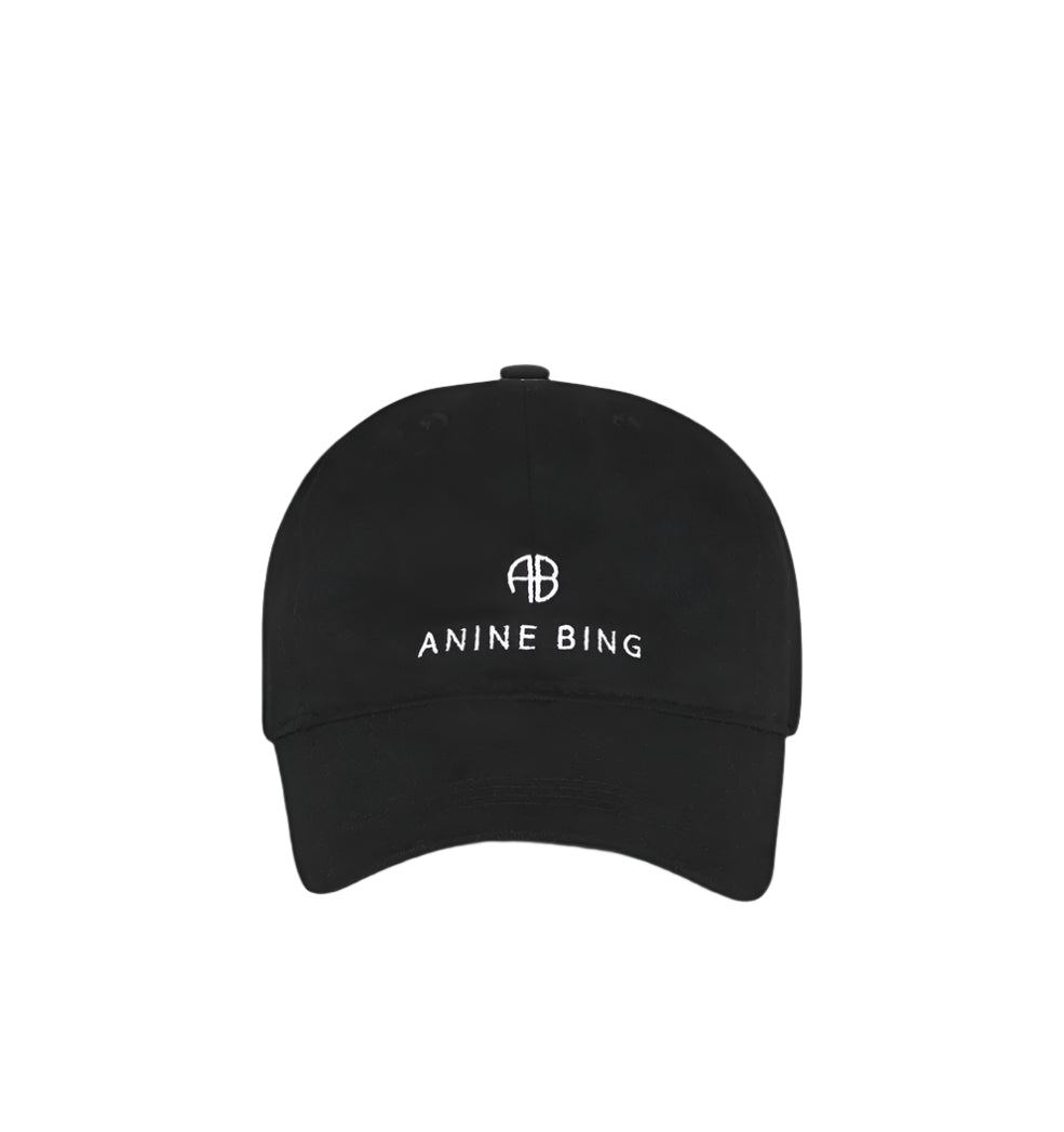 The Jeremy Baseball Cap by Anine Bing in black features a white embroidered logo and "AB ANINE BING" text on the front, plus an adjustable back strap, shown against a plain white background.
