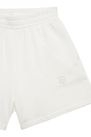 The Anine Bing Kam Short Framed Monogram shorts are white, made from midweight cotton with an elastic waistband and subtle logo embroidery on the left leg.