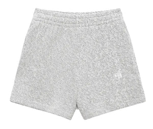 The Kam Short Framed Monogram by Anine Bing: gray marled terry knit shorts with an elastic waistband, shown flat on a light gray background—an effortless off-duty essential.