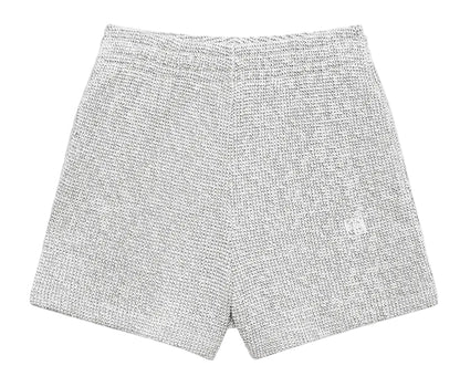 The Kam Short Framed Monogram by Anine Bing: gray marled terry knit shorts with an elastic waistband, shown flat on a light gray background—an effortless off-duty essential.