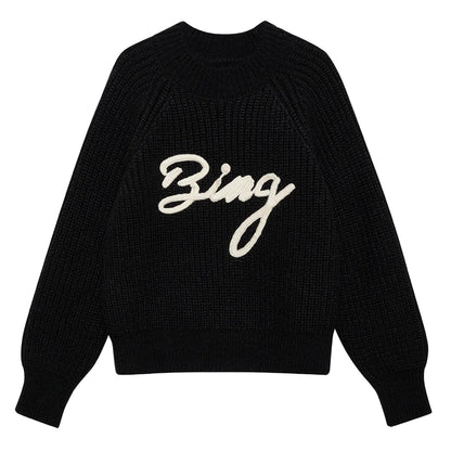The Kendrick Sweater Bing by Anine Bing is a black alpaca-wool sweater with long sleeves and "Bing" in bold white script across the front, offering cozy style with signature AB branding.