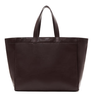 The Large Rio Tote by Anine Bing is a dark brown leather bag with two short handles, shown against a white background—a stylish everyday essential.