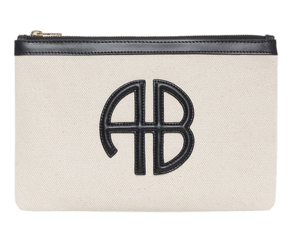 The Lili Canvas Pouch from Anine Bing is a beige cotton clutch with a black zipper and a black leather "AB" monogram on the front, inspired by the brand’s iconic Lili Bag.