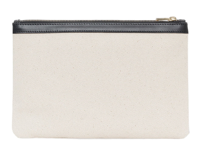 The Lili Canvas Pouch by Anine Bing is a rectangular beige cotton clutch with a black zipper and trim, inspired by the iconic Lili Bag—perfect for stylish essentials.