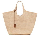 The Lili Raffia Tote by Anine Bing is a spacious handwoven bag featuring two handles and a brown leather strap detail, shown here on a white background—an everyday carryall ideal for any outing.