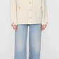 A person wears the Anine Bing Luca Cashmere Blend Jacket in cream, paired with light blue wide-leg jeans and black flats, standing against a plain background.