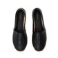 The Paloma Espadrilles by Anine Bing are black leather espadrilles with a woven sole and front embossing, featuring the gold ANINE BING monogram on the insole.