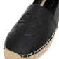 Close-up of an Anine Bing Paloma Espadrille on a white background, featuring a raised logo and braided jute sole.