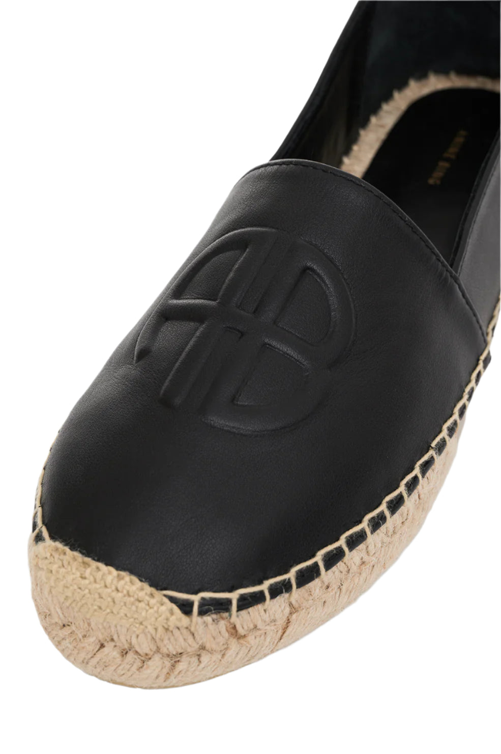 Close-up of an Anine Bing Paloma Espadrille on a white background, featuring a raised logo and braided jute sole.