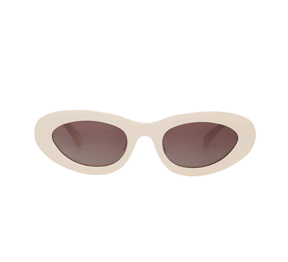 The Anine Bing Roma Sunglasses feature thick off-white bone acetate oval cat-eye frames with dark brown gradient lenses, shown against a white background.
