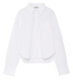 The Scott Cropped Shirt by Anine Bing is a white long-sleeve button-up featuring a collar, chest pocket, and subtly curved hem. Made from crisp cotton poplin for comfortable wear, it boasts a relaxed silhouette and is showcased against a plain white background.