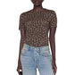 Wearing the ANB Sylvie Tee by Anine Bing—a short-sleeve, brown and black leopard print crewneck made from super soft, sheer jersey fabric—paired with light blue jeans, the person stands against a white background.