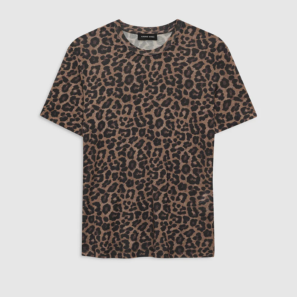 The Sylvie Tee by Anine Bing is a short-sleeve crewneck top featuring an all-over brown and black leopard print, crafted from super soft fabric and shown against a plain white background.