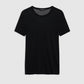 The Sylvie Tee by Anine Bing, a super soft plain black short-sleeve crewneck, is displayed against a light gray background.