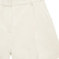The Trent Short by Anine Bing is a high-waisted, cream-colored short made from suiting fabric with belt loops and a front zipper.