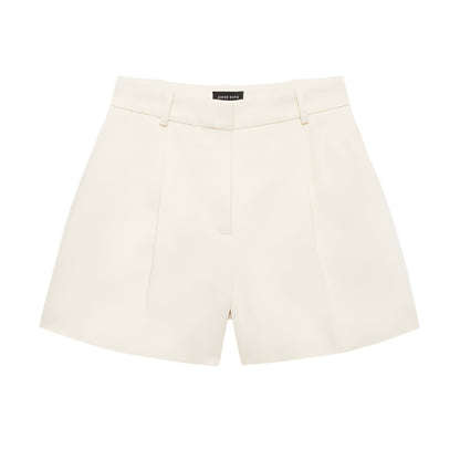 The Trent Short by Anine Bing is a high-waisted, cream-colored suiting short with belt loops and front pleats, shown on a white background.