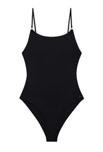 The Anine Bing Vesta One Piece is a black minimalist swimsuit with adjustable shoulder straps and a high-cut leg, shown on a white background.