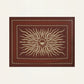 The Golden Horizon Pareo by Johanna Ortiz features a central sunburst motif in beige on deep red, framed by geometric beige and red borders—ideal for personal styling or as a versatile scarf-inspired accent.