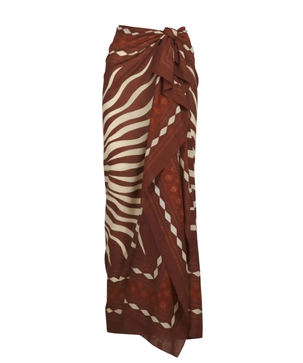 The Golden Horizon Pareo by Johanna Ortiz features a brown and cream wavy stripe pattern, adjustable waist tie, and chic wrap style—perfect for styling or wearing as a versatile pareo.