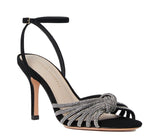 The Loeffler Randall Ada Black Knot Heeled Sandal features black suede with rhinestone embellishments, an ankle strap, and a knotted design across the front.