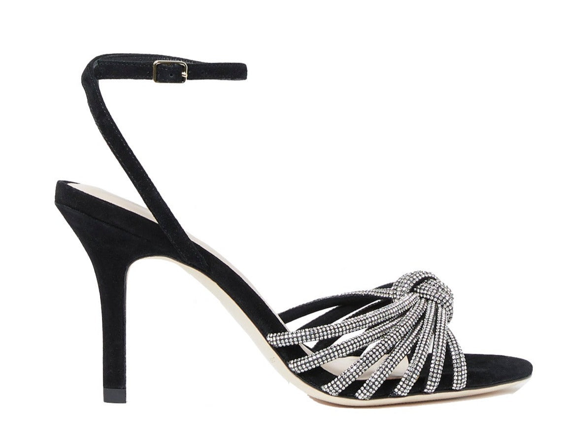 Loeffler Randall Ada Black Knot Heeled Sandal by Loeffler Randall is a black suede high-heeled sandal featuring an ankle strap adorned with decorative silver bead embellishments and sparkling rhinestones.