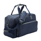The Peter Millar Pursuit Duffle is a navy blue travel bag featuring black zippers, handles, an adjustable shoulder strap, and a front laptop zipper pocket, shown on a white background.