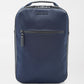 The Peter Millar Pursuit Shoe Bag is a navy blue rectangular bag with a top handle, genuine leather trim, front zip pocket, and "Peter Millar" branding—ideal for stylishly storing daily essentials.