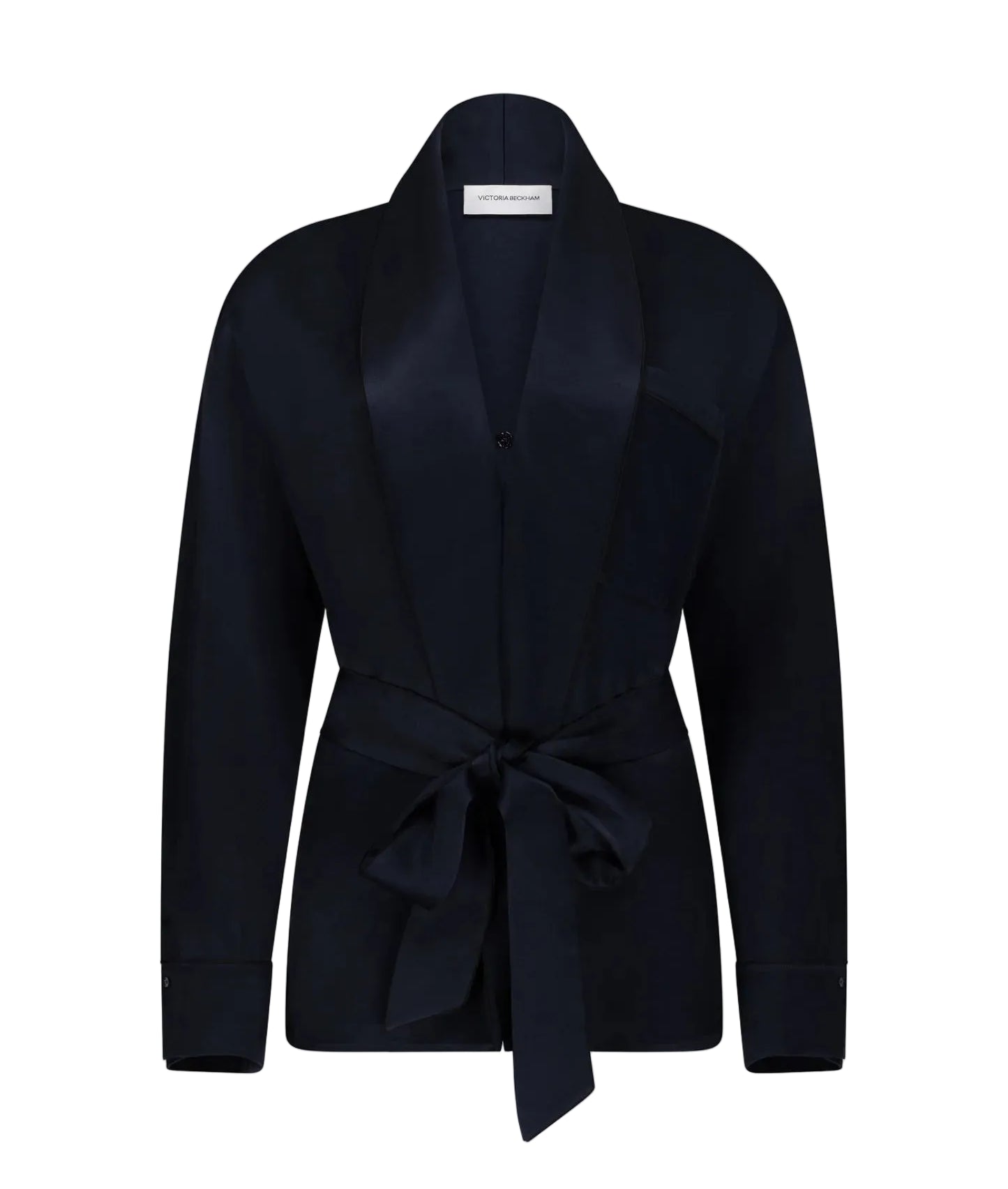 The Alba Blouse by Victoria Beckham is a black long-sleeve top with a shawl collar and matching fabric belt tied at the waist, featuring an elegant drape, displayed on a plain white background.