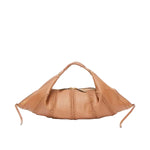 The Luna Leather Craft Bag by 3.1 Phillip Lim features tan lamb nappa leather, a woven design, short handle, zipper closure, and elongated sides with loose strap ends—an essential modern handbag for travel.
