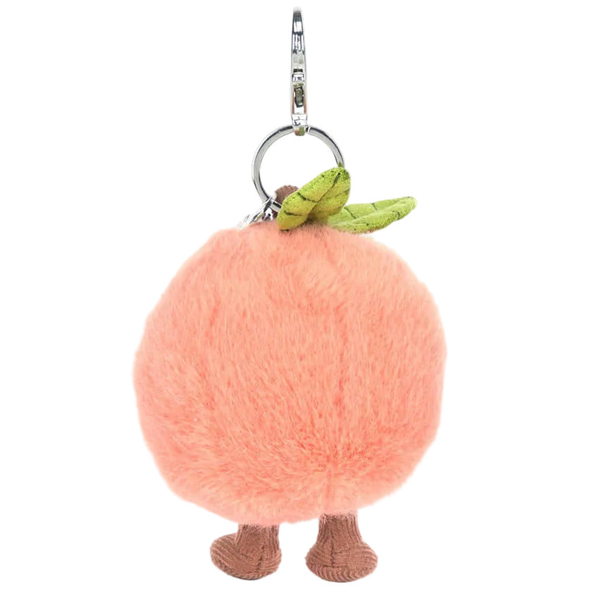 The Jellycat Amuseables Peach Bag Charm is a plush keychain shaped like a peach, featuring green felt leaves and brown legs—an adorable accessory for any bag.
