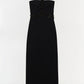 Simkhai Zoriel gown in black crepe, featuring a strapless design with a beaded halter neckline and matching beaded waist trim.